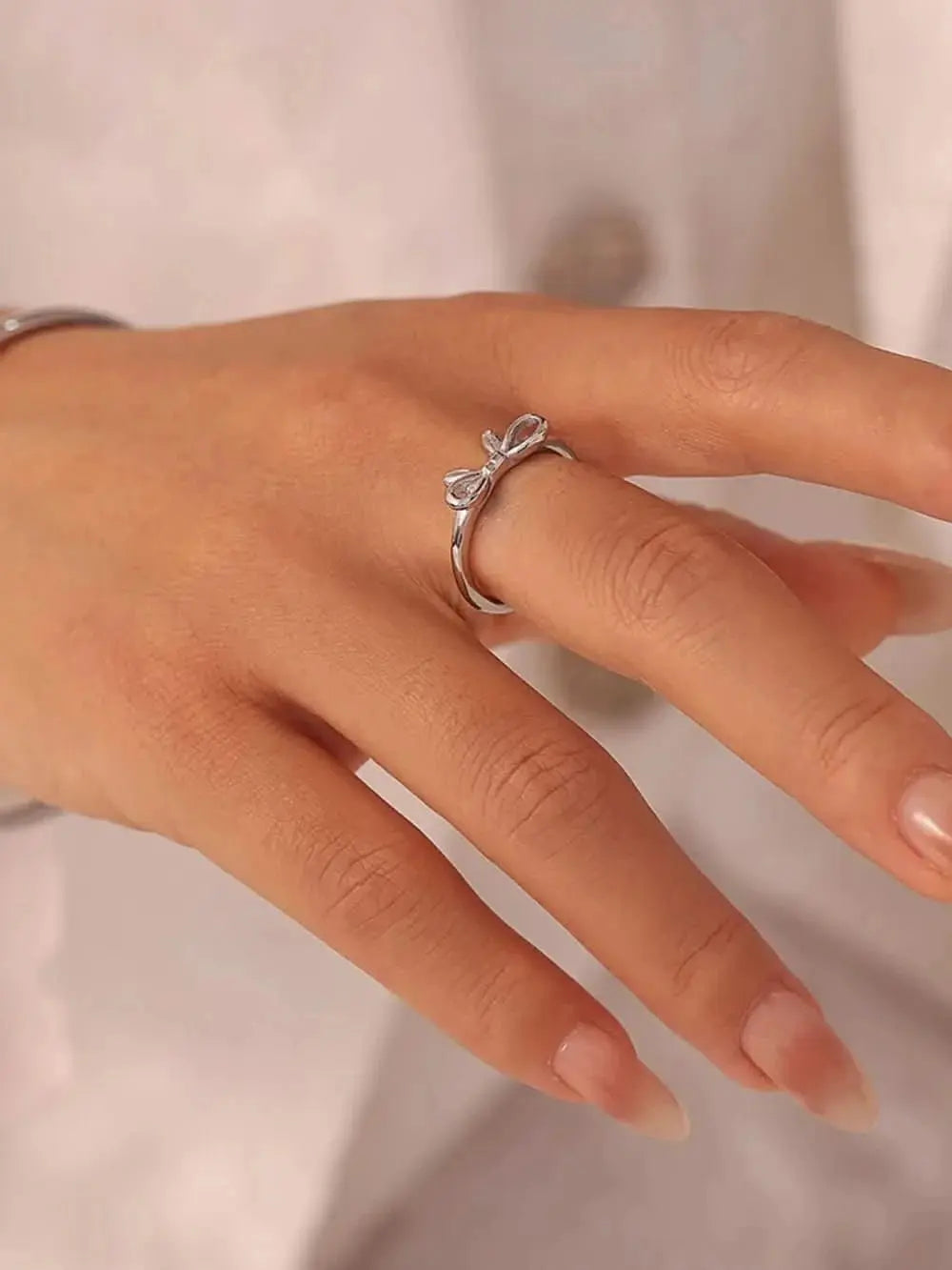 stainless-steel-bow-ring-around-the-world-in-a-rush-4199730